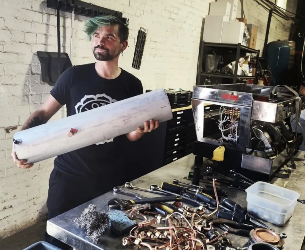 White Duck Espresso technician servicing an espresso machine